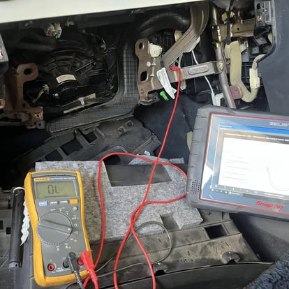 Mechanic discussing a vehicle repair with a customer