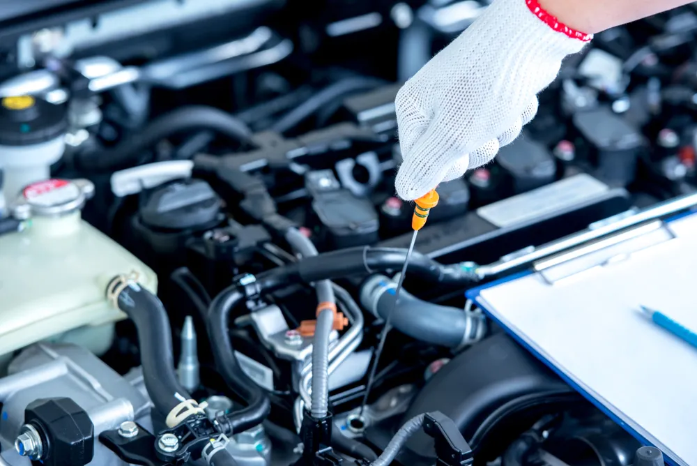 Mechanic carrying out mechanical repairs on a vehicle